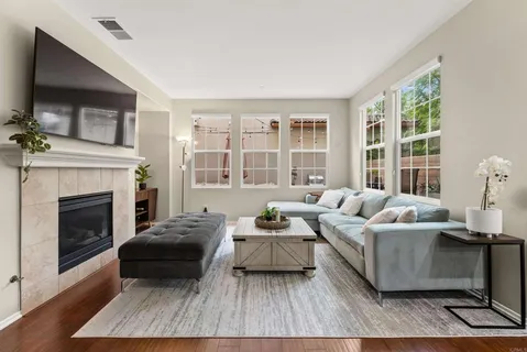 a living room with furniture and a fireplace