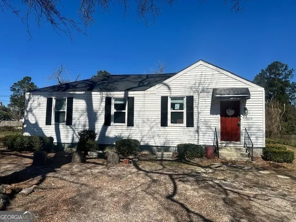 a front view of a house with yard