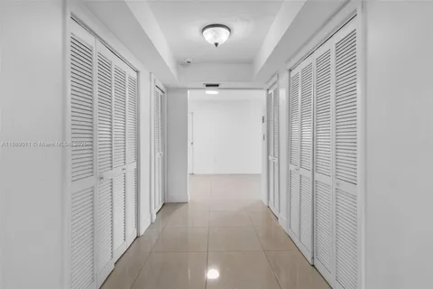 a bedroom with furniture and a potted plant