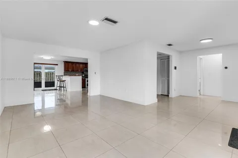 a view of livingroom with furniture and floor to ceiling window