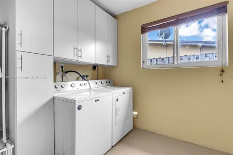 a view of a house with yard and a garden