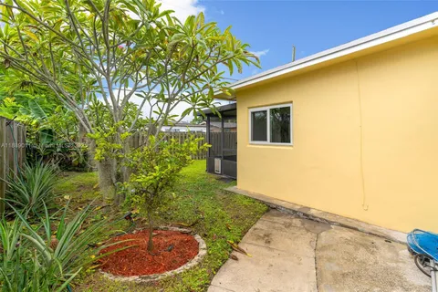 a yellow house with a outdoor space