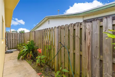 a view of a house with a yard and garage