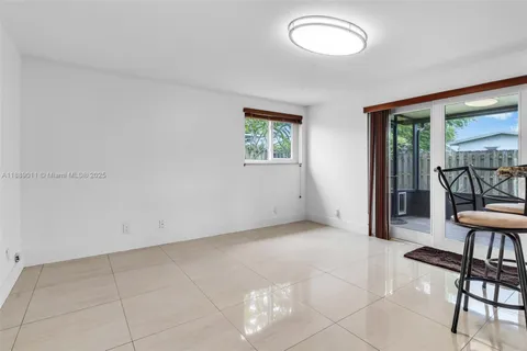a view of a livingroom with furniture and a flat screen tv