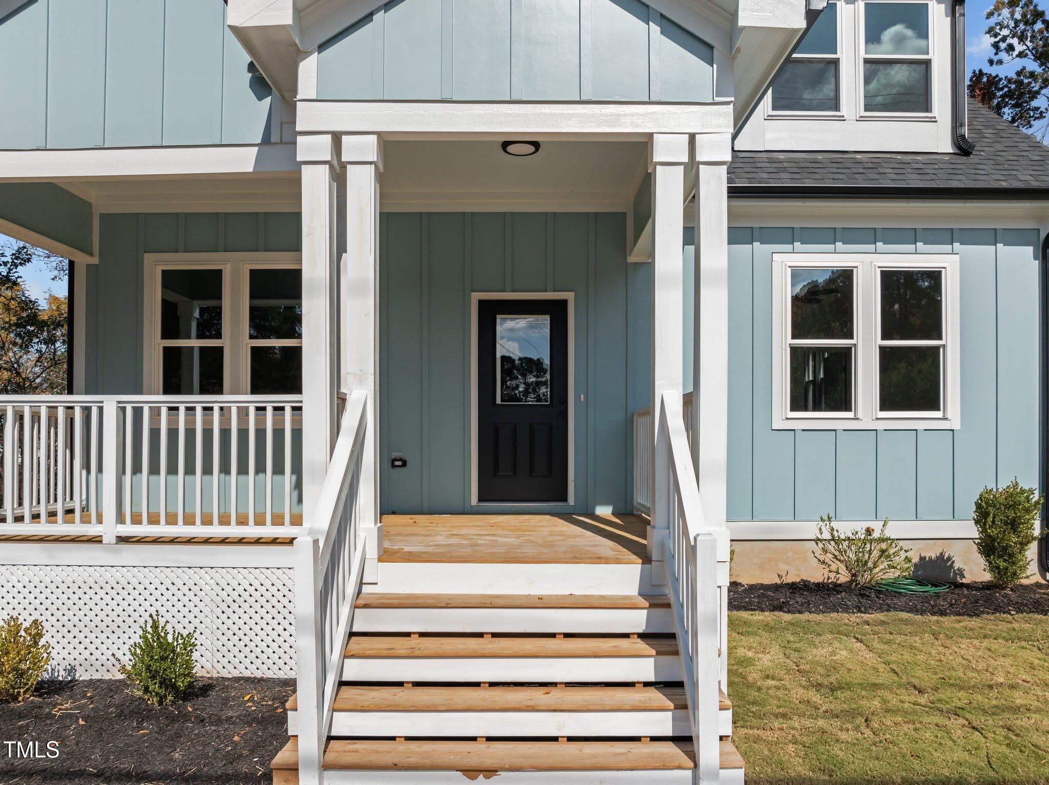 2015 Cheek Road Durham, NC 27704 - Photo 11 of 12 a front view of a house with a porch