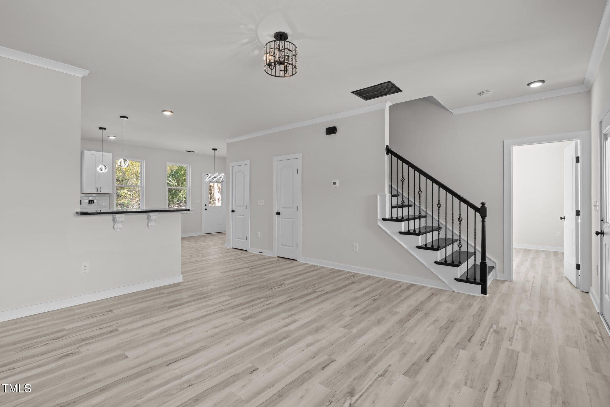 2015 Cheek Road Durham, NC 27704 - Photo 2 of 12 a view of a room with wooden floor and staircase
