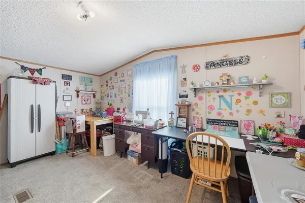 a view of a workspace with furniture and toys