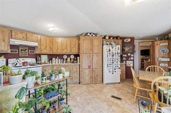 a view of a kitchen and dining area with furniture