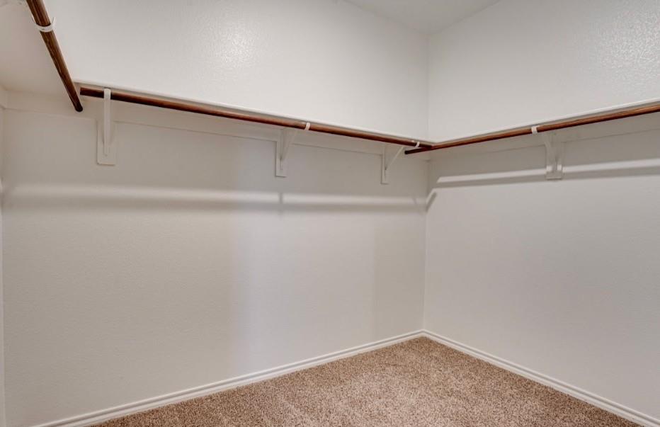 1614 Potomac Lane Blue Ridge, TX 75424 - Photo 7 of 18 Walk-in closet featuring light-colored walls and brown carpet flooring