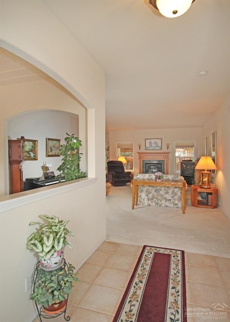 375 Southeast Soft Tail Loop Bend, OR 97702 - Photo 25 of 25 Tile Foyer with open floor plan draws on