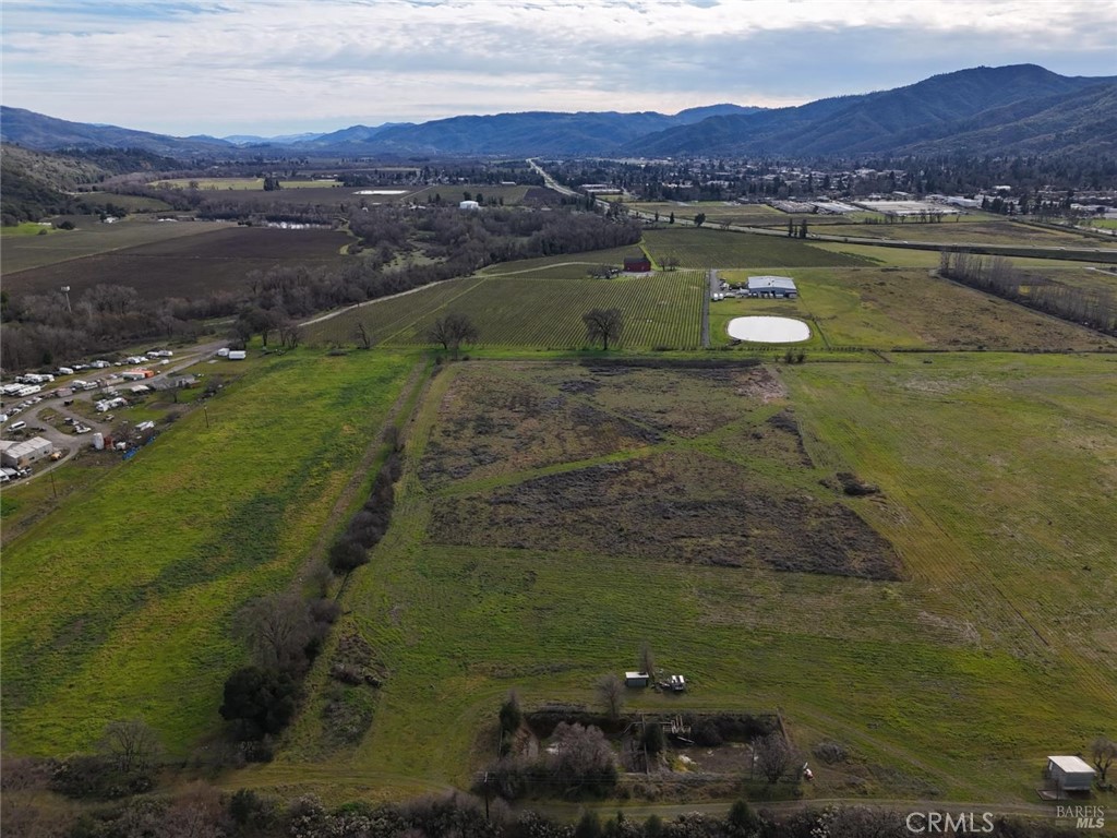 585 Kunzler Ranch Road Ukiah, CA 95482 - Photo 4 of 10 a view of a lake with a mountain in the background