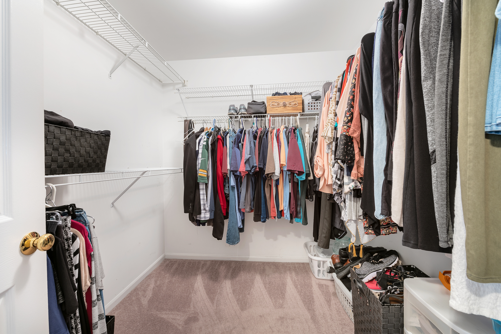 1145 Coldspring Road Elgin, IL 60120 - Photo 14 of 20 a view of walk in closet with clothes and shoes