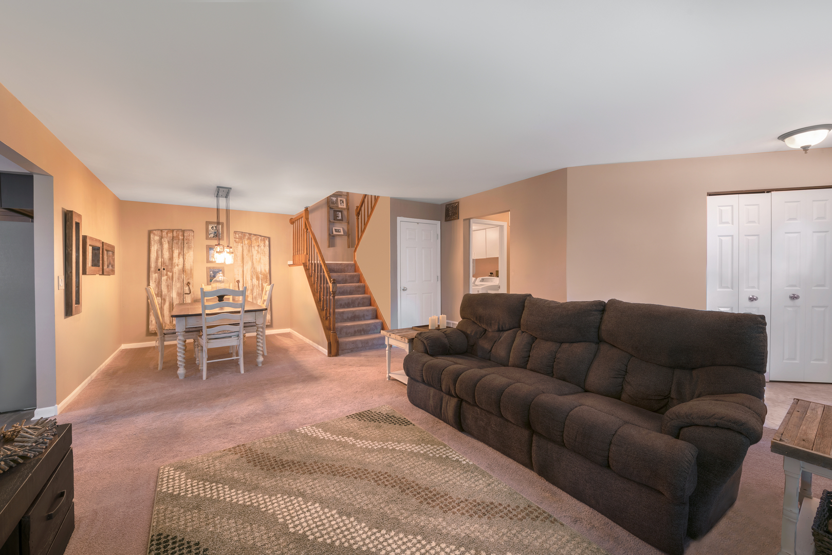 1145 Coldspring Road Elgin, IL 60120 - Photo 3 of 20 a living room with furniture and a dining table with kitchen view