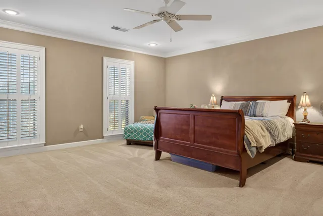 a spacious bedroom with a bed and window