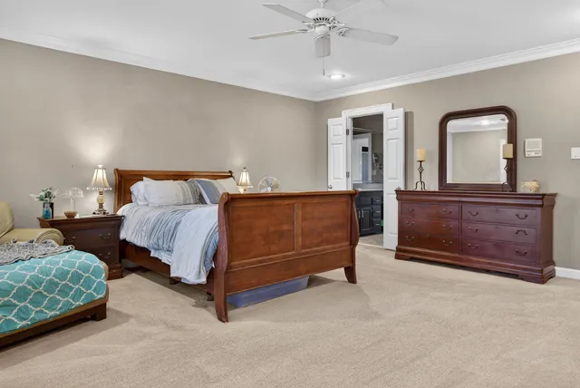 a bedroom with a bed and a dresser