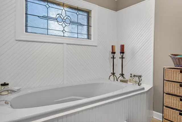 a bathroom with a bathtub and a sink