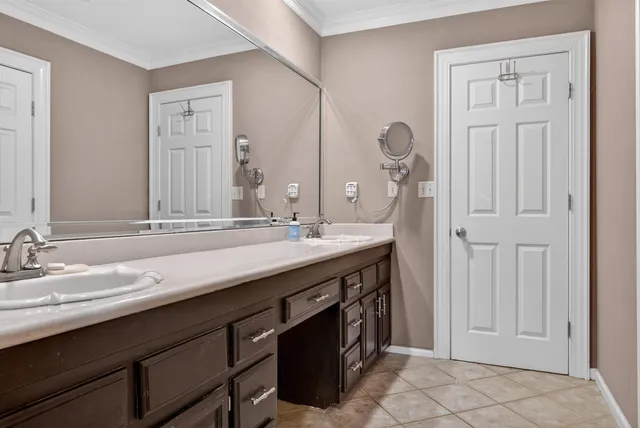 a bathroom with a double vanity sink and a mirror