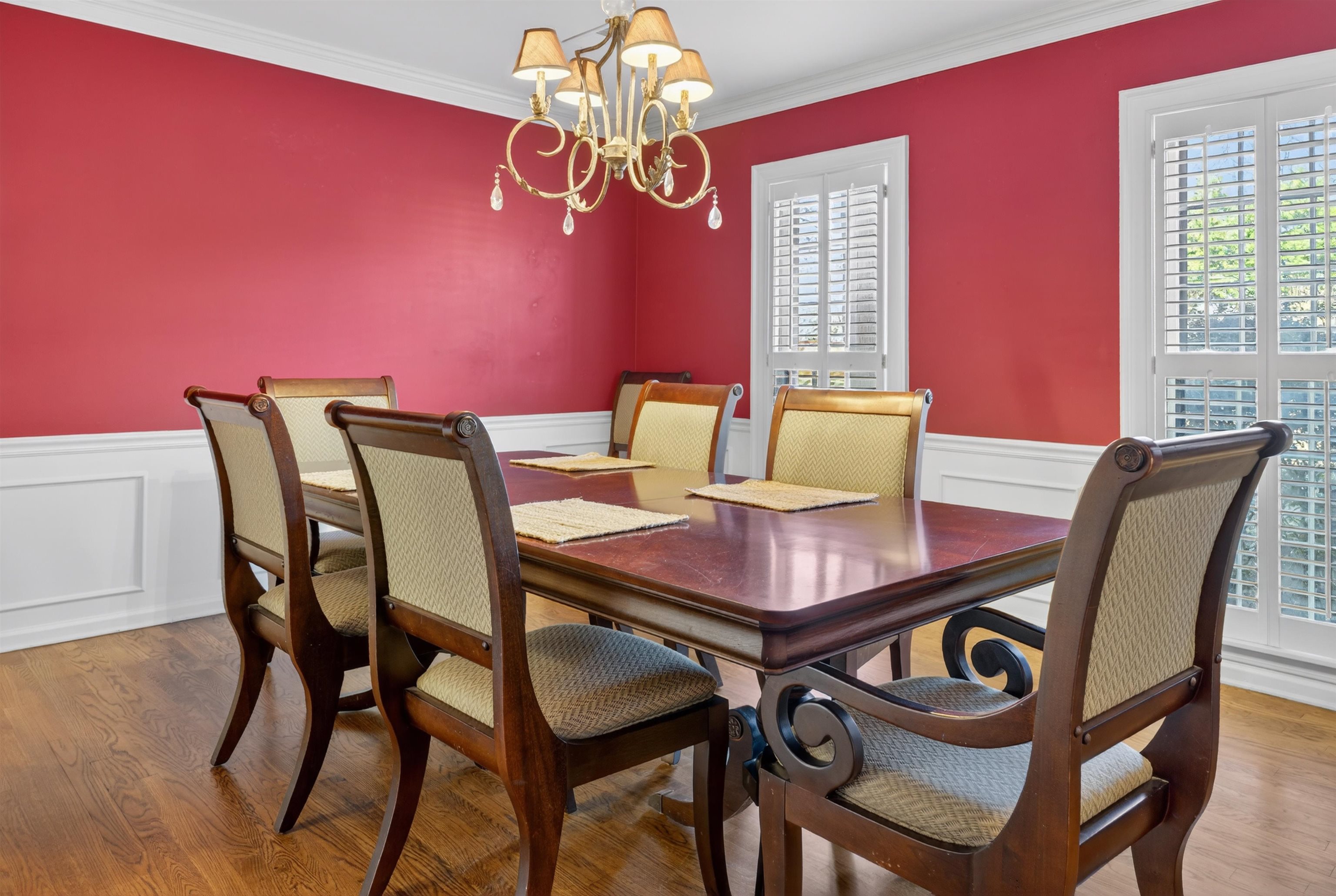 1195 Frank Road Collierville, TN 38017 - Photo 27 of 35 Dining room with a wainscoted wall, a decorative wall, light wood finished floors, crown molding, and a chandelier