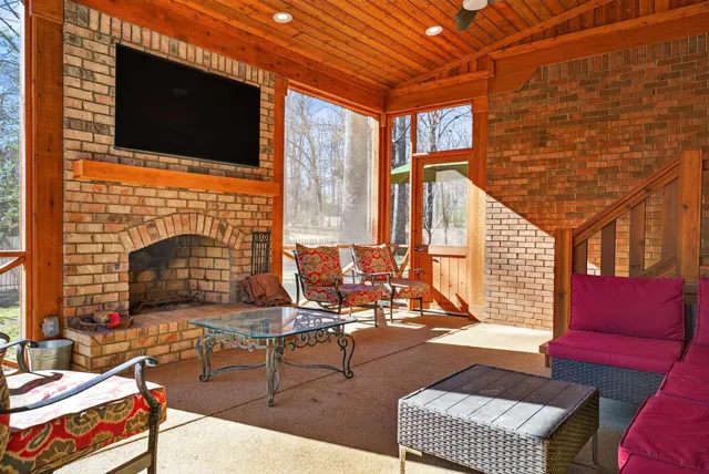 a view of a livingroom with furniture and a fireplace