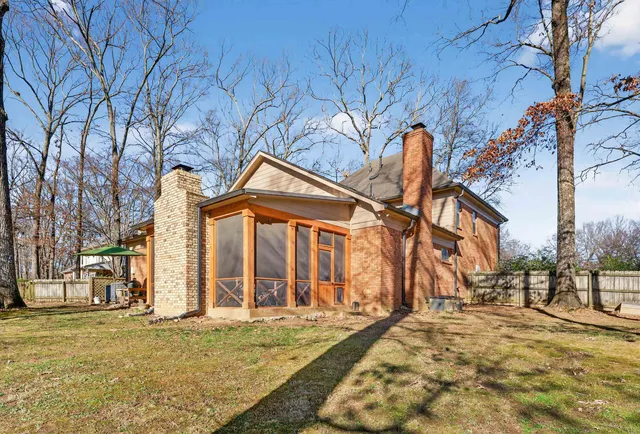 a view of a building with snow on the road