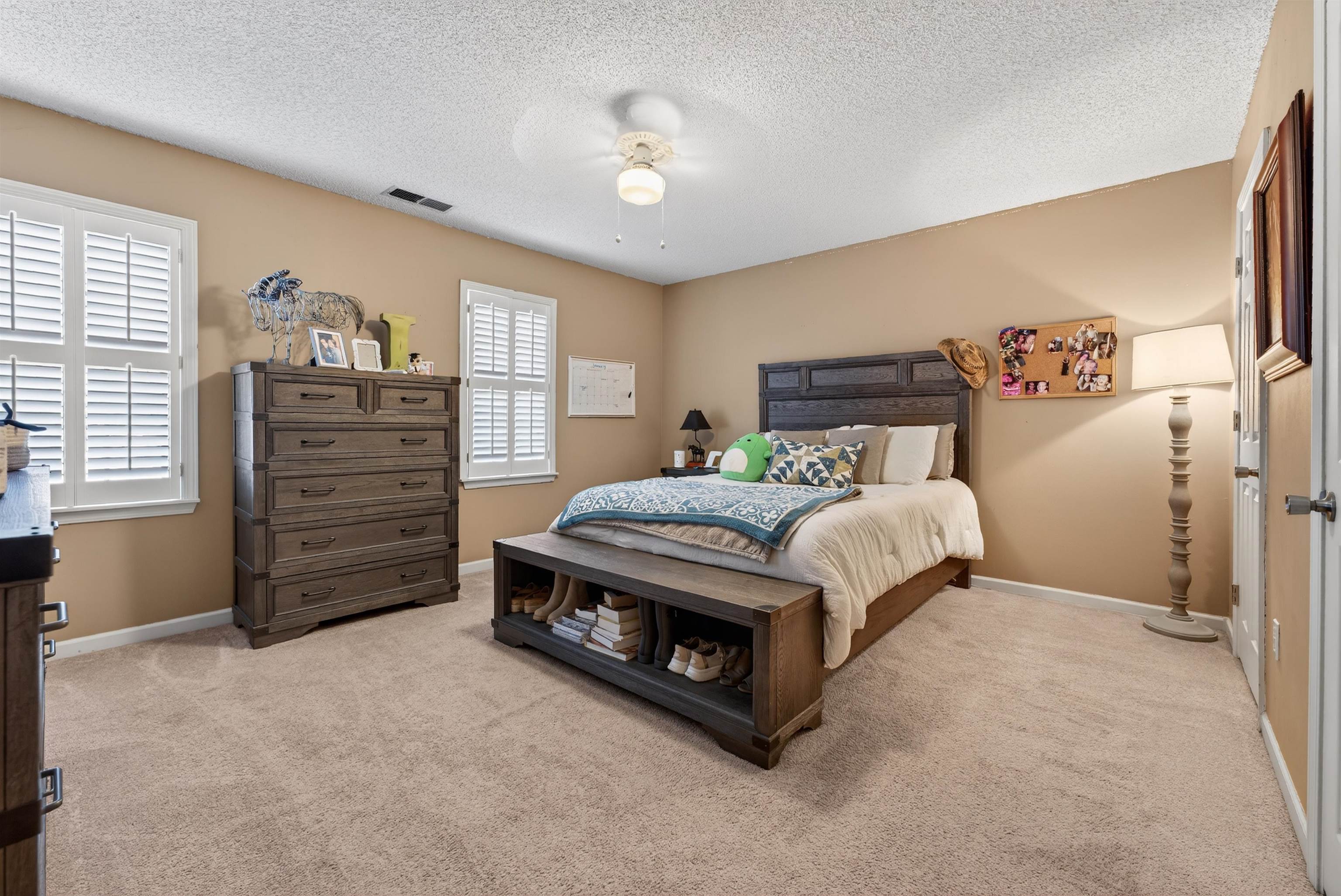 1195 Frank Road Collierville, TN 38017 - Photo 8 of 35 Bedroom featuring a textured ceiling, light colored carpet, and ceiling fan