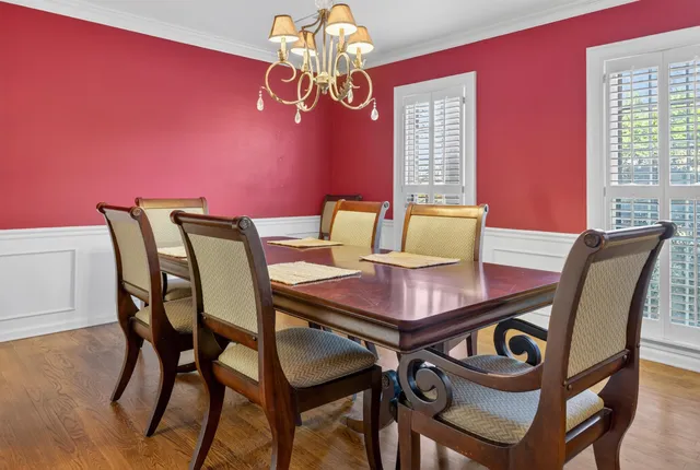 a view of a dining room with furniture and window