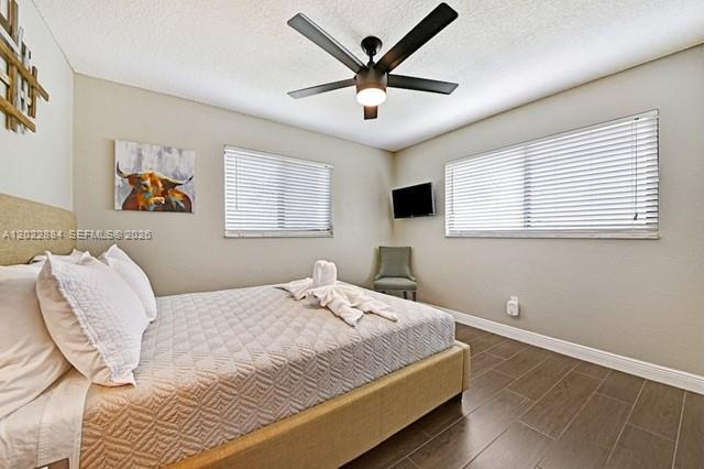 945 Sunset Road, Unit 1 West Palm Beach, FL 33401 - Photo 13 of 20 a bedroom with a bed and window