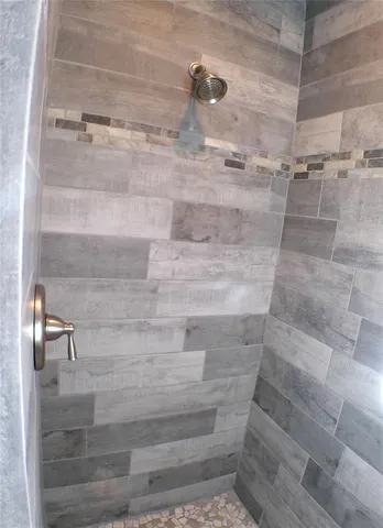 a living room with a bed furniture and a window