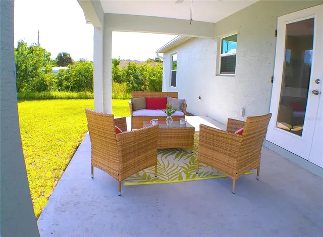 a living room with furniture and a large window