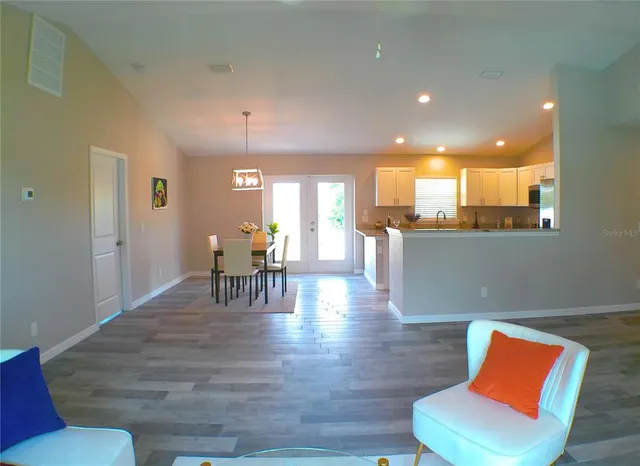 a living room with furniture and a table