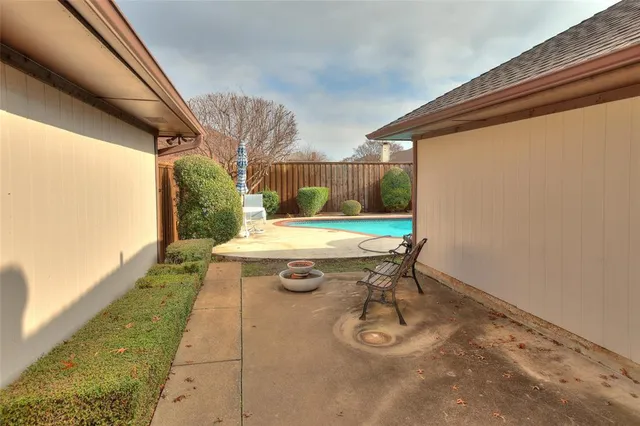 a view of a house with backyard porch and sitting area