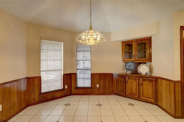 a view of an empty room with a ceiling fan