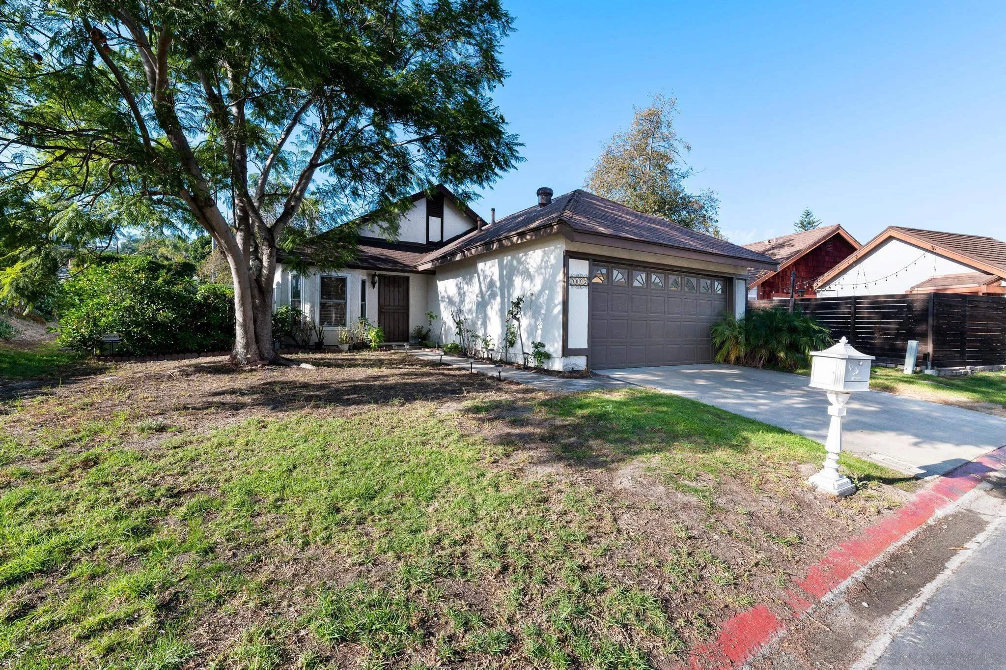 3002 Highlands Way Spring Valley, CA 91977 - Photo 1 of 21 a front view of a house with garden