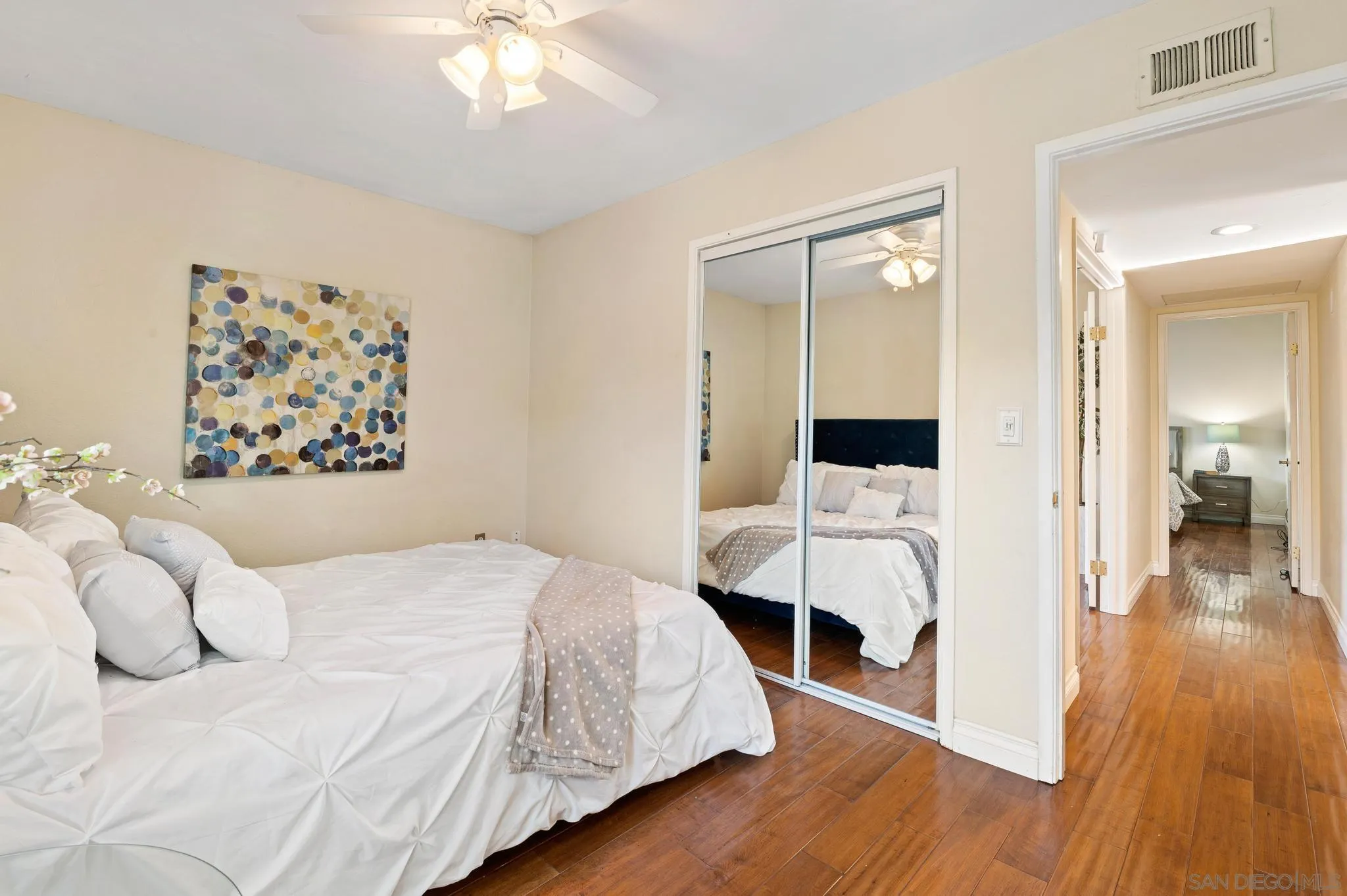 3002 Highlands Way Spring Valley, CA 91977 - Photo 12 of 21 a bedroom with a large bed and a chandelier
