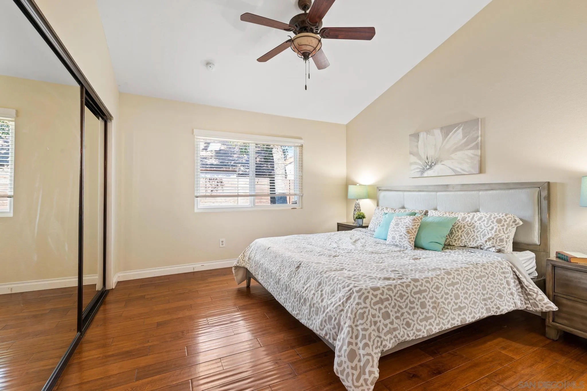 3002 Highlands Way Spring Valley, CA 91977 - Photo 15 of 21 a bedroom with a large bed and wooden floor