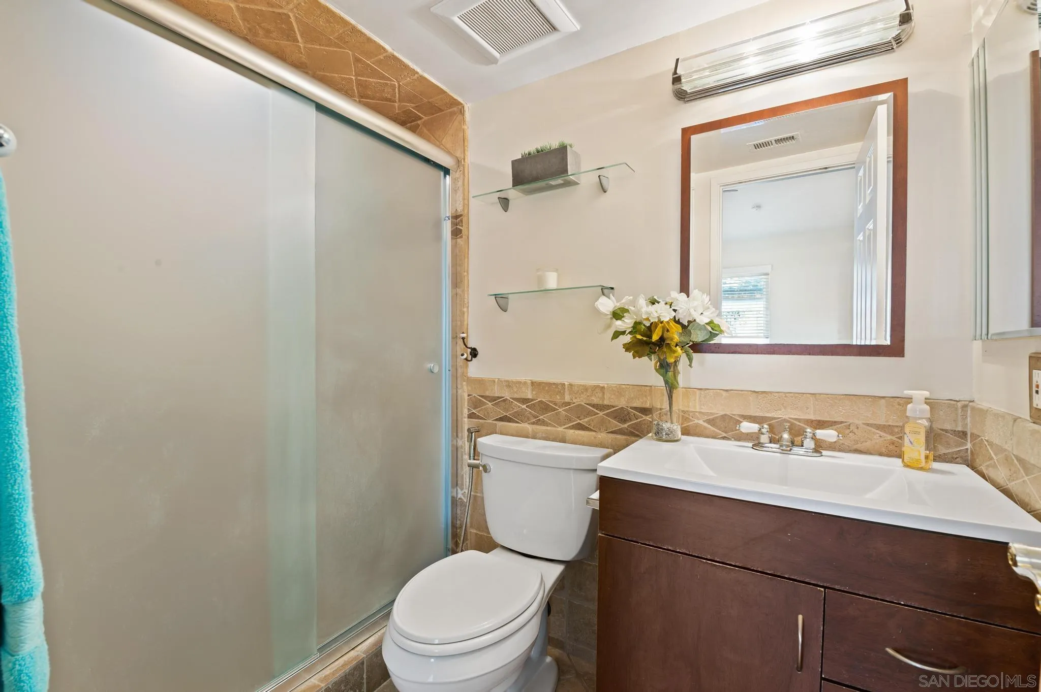 3002 Highlands Way Spring Valley, CA 91977 - Photo 17 of 21 a bathroom with a sink vanity mirror and toilet
