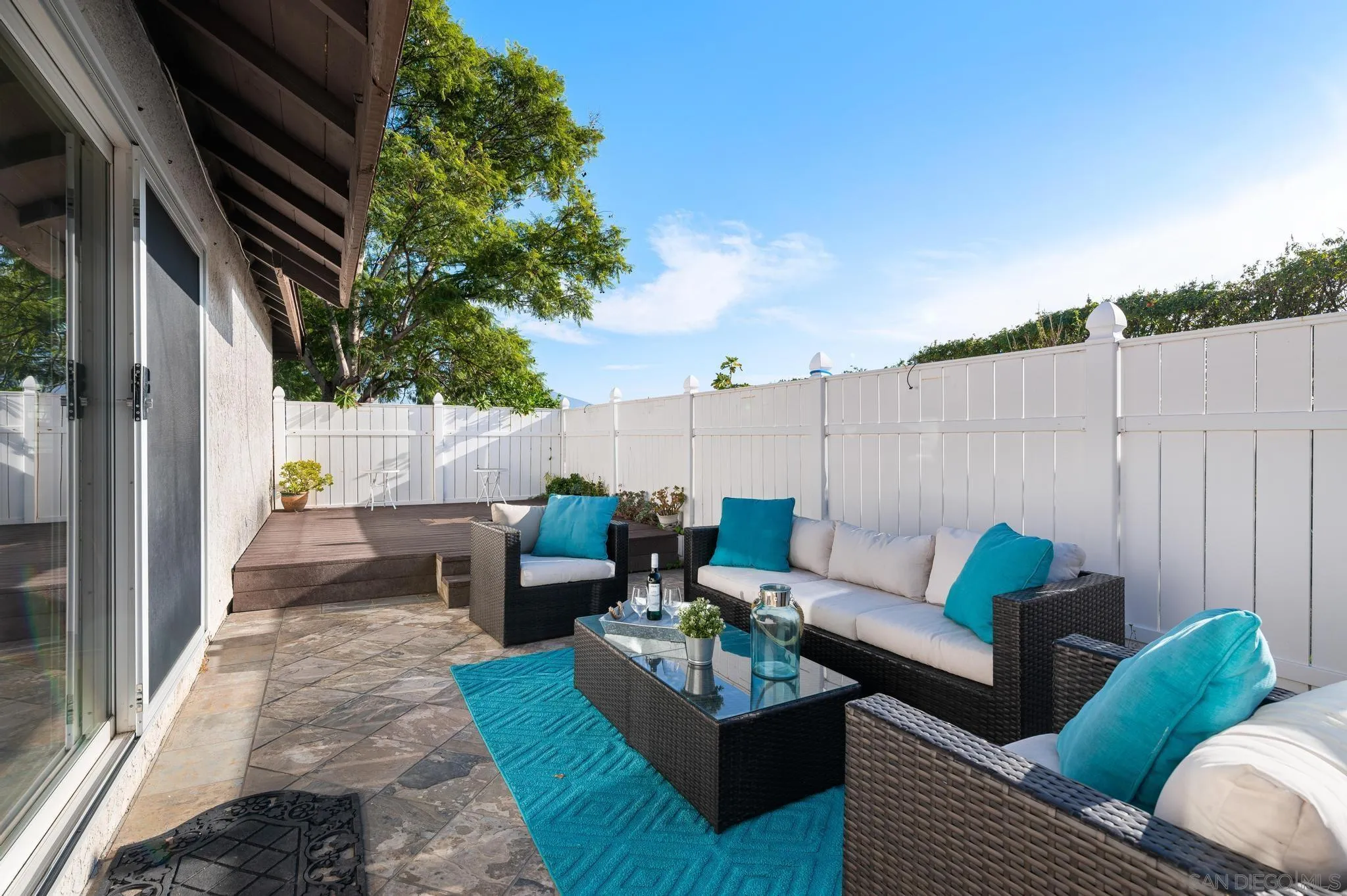 3002 Highlands Way Spring Valley, CA 91977 - Photo 19 of 21 a view of a patio with couches and a potted plant on a table