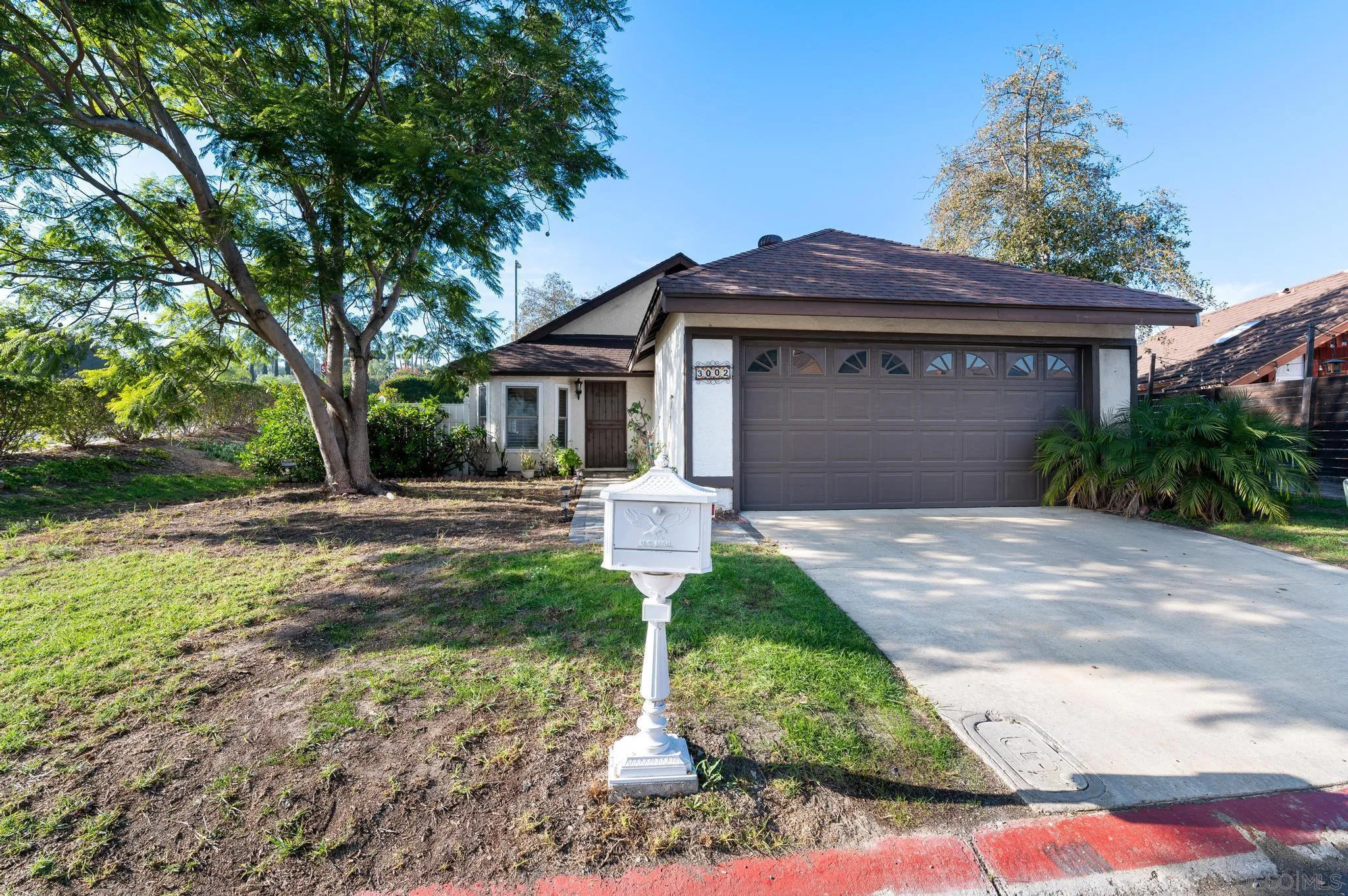 3002 Highlands Way Spring Valley, CA 91977 - Photo 2 of 21 a front view of a house with garden