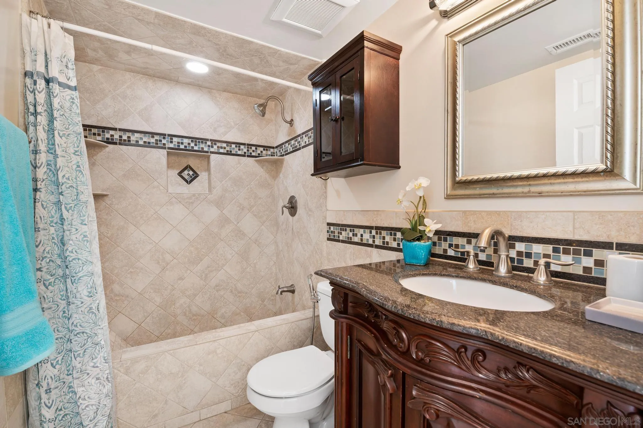 3002 Highlands Way Spring Valley, CA 91977 - Photo 10 of 21 a bathroom with a granite countertop sink toilet mirror and shower