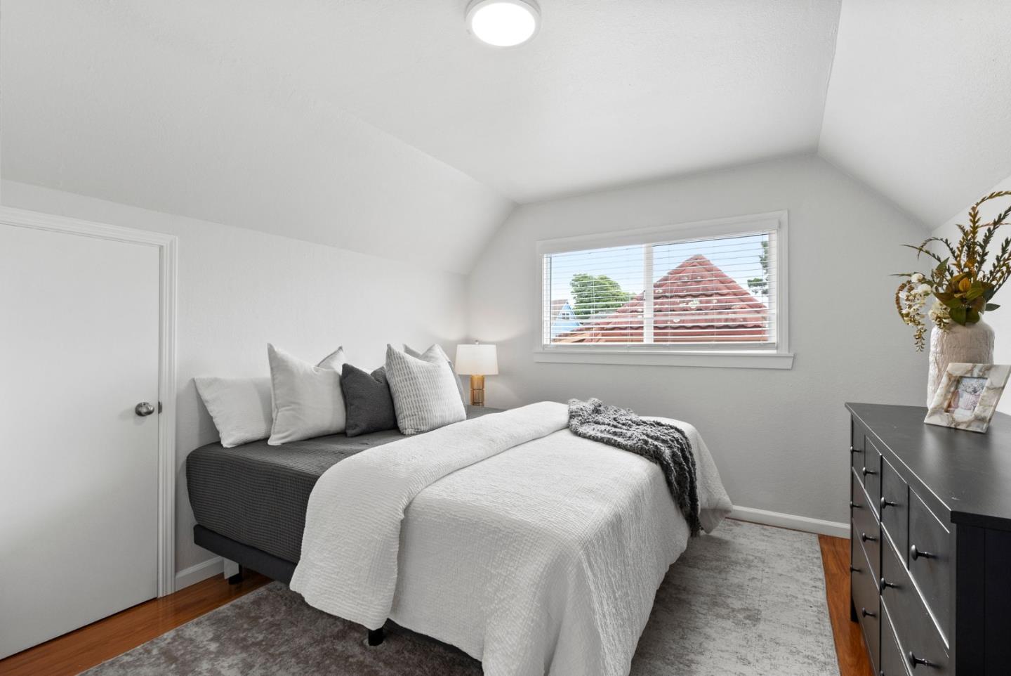 589 Inverness Drive Pacifica, CA 94044 - Photo 12 of 21 a bedroom with bed and a window