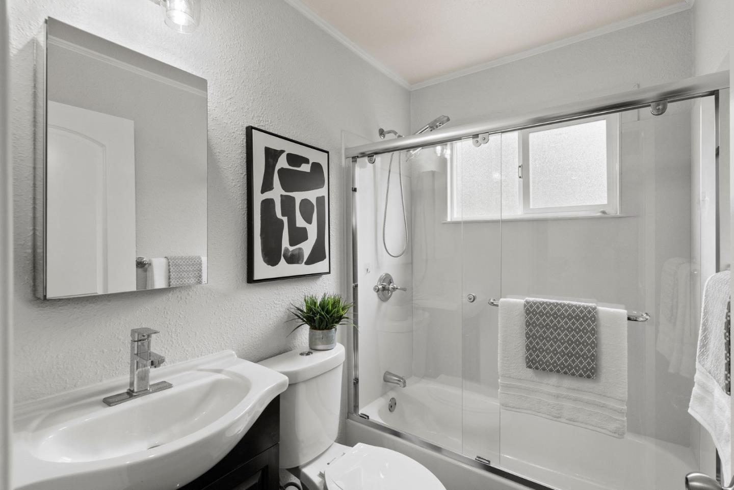 589 Inverness Drive Pacifica, CA 94044 - Photo 14 of 21 a bathroom with a sink toilet and shower