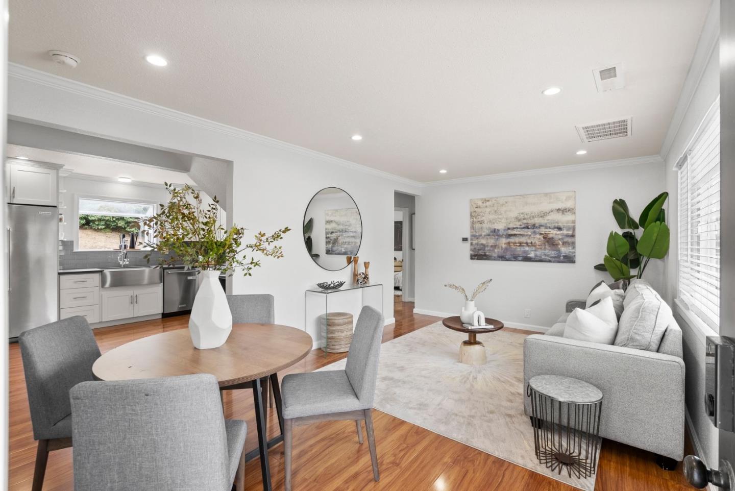 589 Inverness Drive Pacifica, CA 94044 - Photo 2 of 21 a living room with furniture a chandelier and a table