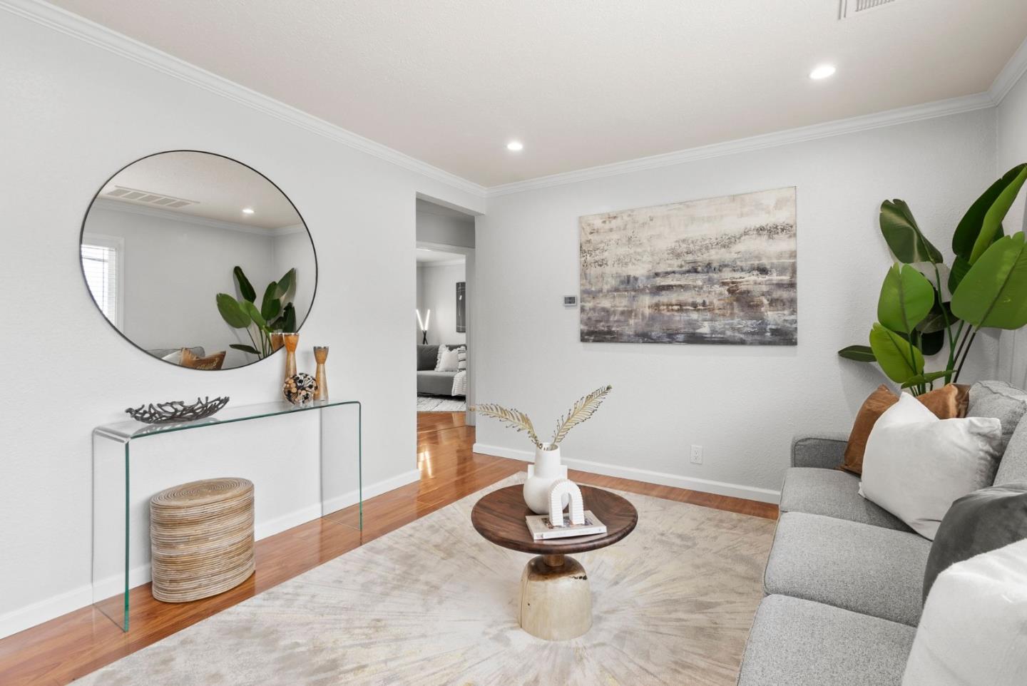589 Inverness Drive Pacifica, CA 94044 - Photo 3 of 21 a living room with furniture a mirror and a potted plant