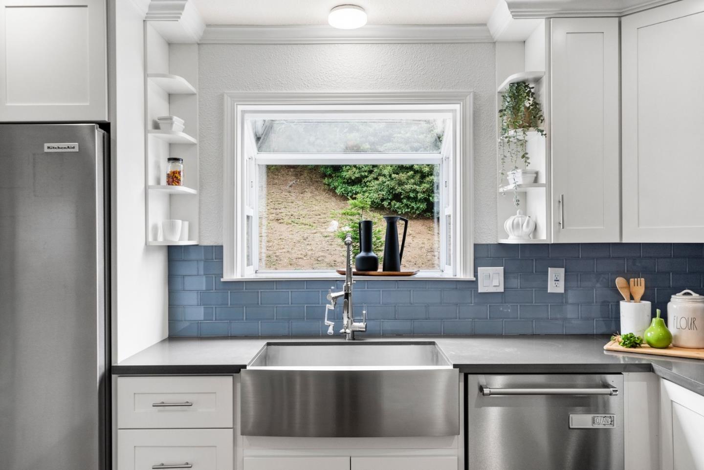 589 Inverness Drive Pacifica, CA 94044 - Photo 6 of 21 a kitchen with stainless steel appliances granite countertop a sink and cabinets