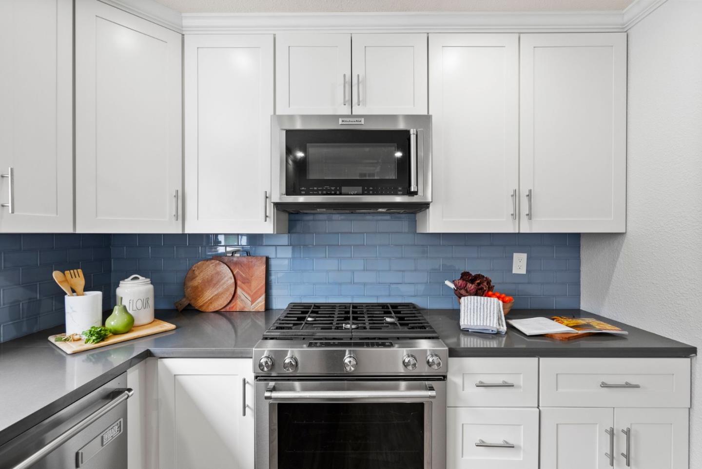 589 Inverness Drive Pacifica, CA 94044 - Photo 7 of 21 a kitchen with a stove and a microwave