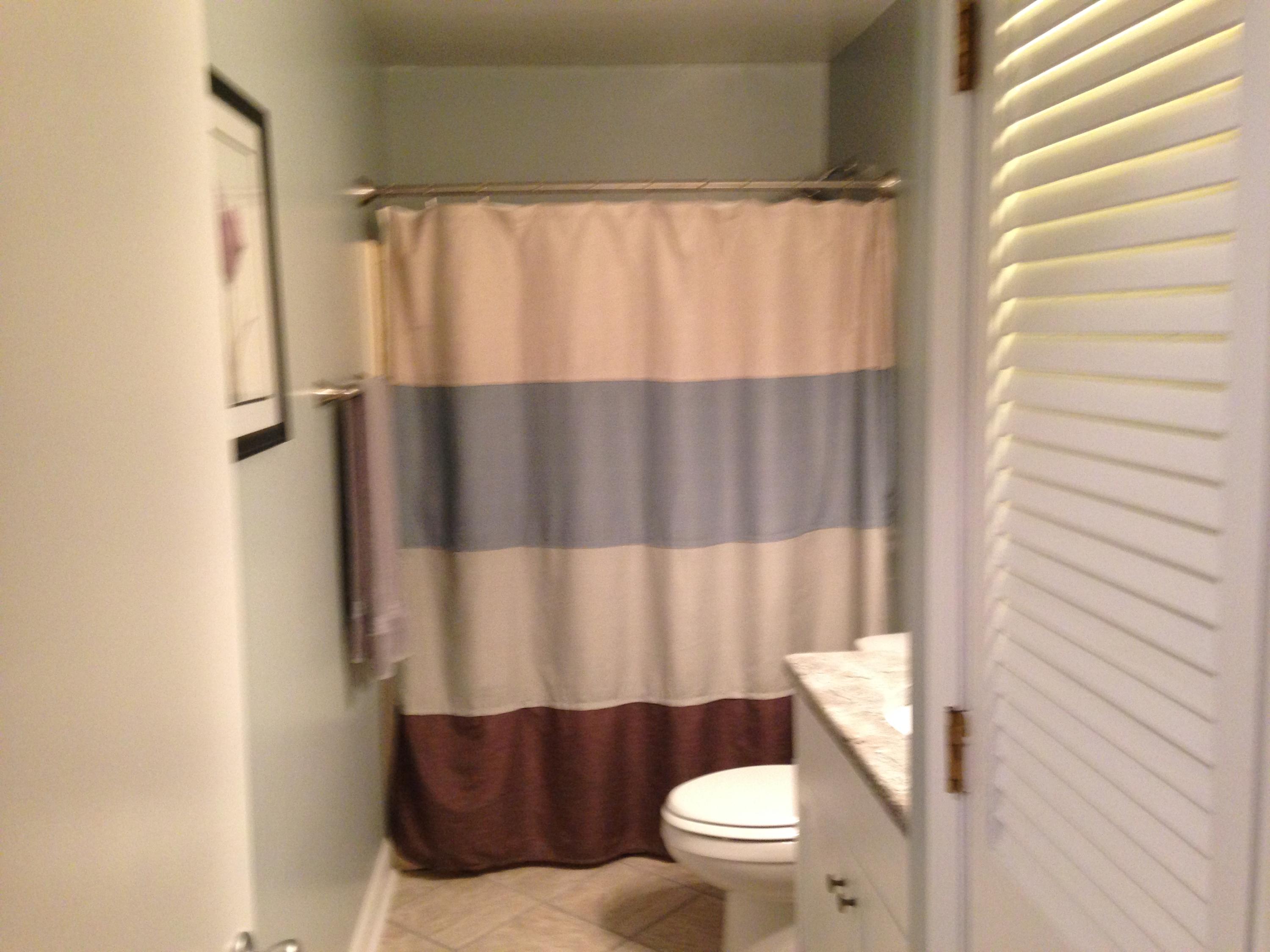 2205 Ridge Road Roanoke, VA 24014 - Photo 22 of 62 a bathroom with a toilet and a shower curtain