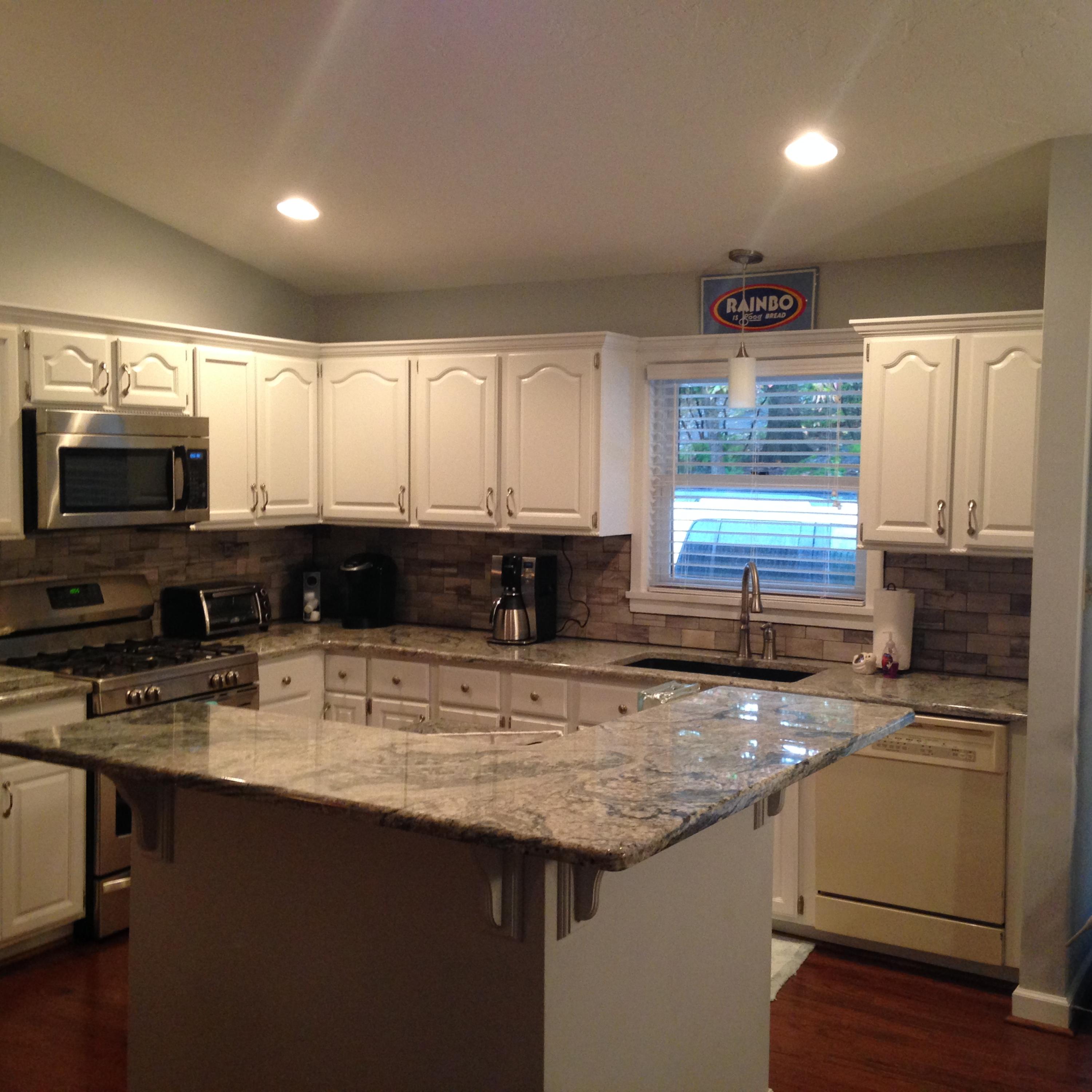 2205 Ridge Road Roanoke, VA 24014 - Photo 42 of 62 a kitchen with stainless steel appliances granite countertop a sink a stove a microwave a refrigerator a counter space and cabinets