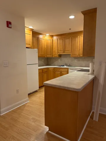 a view of a kitchen with a sink and dishwasher