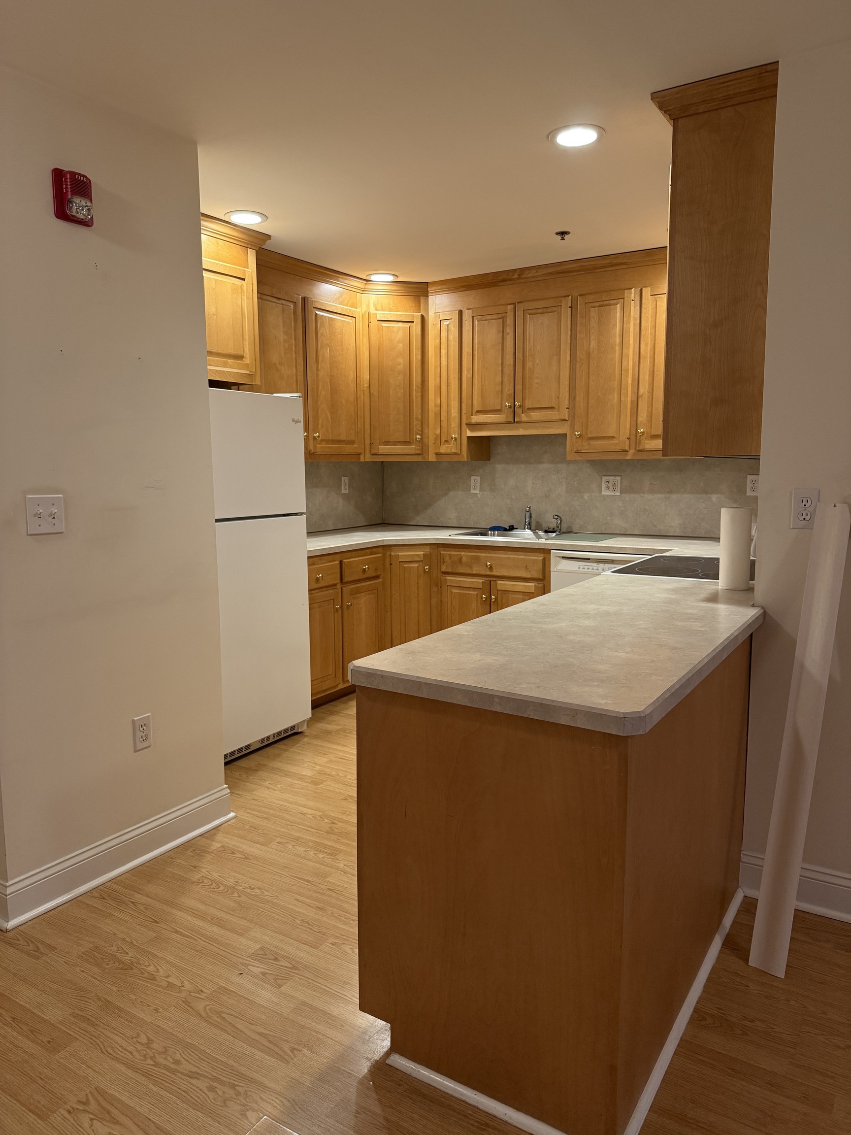 380 Main Street, Unit 4 Wallingford, CT 06492 - Photo 5 of 11 a view of a kitchen with a sink and dishwasher
