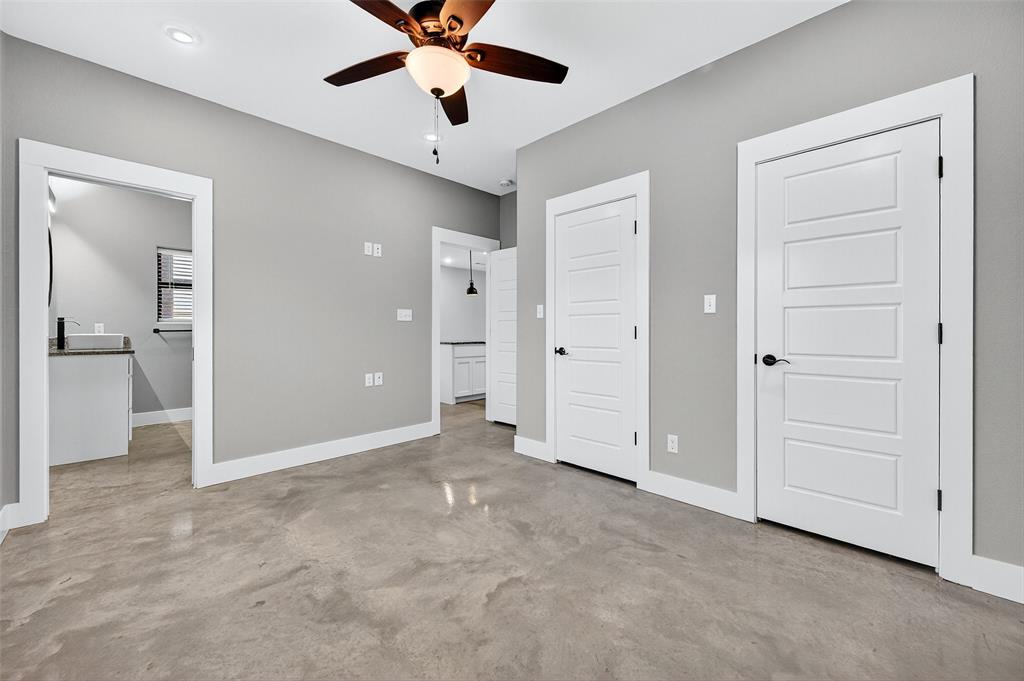 1431 South 7th Avenue Denison, TX 75021 - Photo 13 of 21 an empty room with fan and entrance